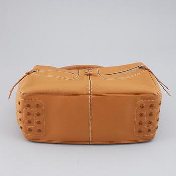 TOD'S, a tan leather bag.