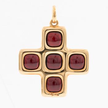 An 18K gold and garnet Pomellato cross.