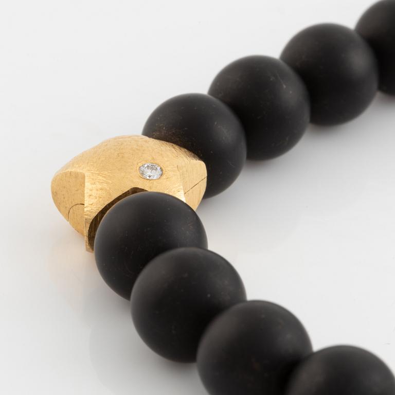 Ole Lynggaard, black stone  bead necklace, clasp star 18K gold with brilliant cut diamond.