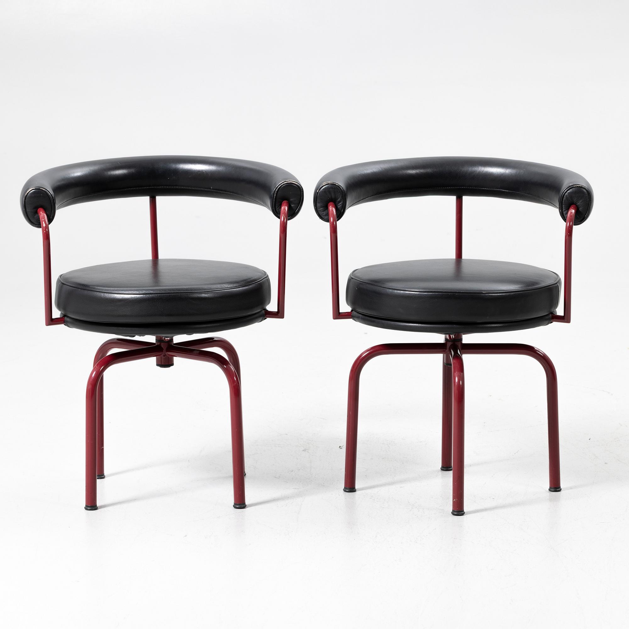 Charlotte Perriand, /Le Corbusier, swivel armchairs, a pair, model LC7, Cassina, Italy, latter half of the 20th century.