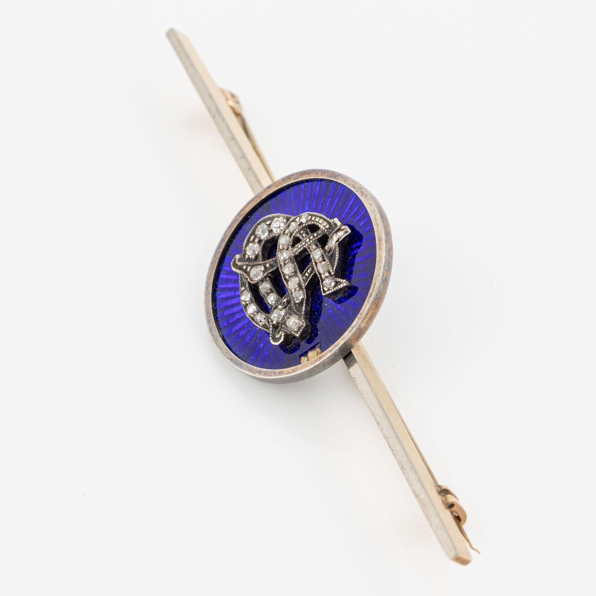 Brooch, gold/silver with blue enamel and monogram set with rose-cut diamonds.