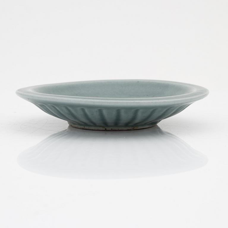 A celadon dish, for the south east asian market, double fish, Mingstyle, 20th Century. And a Chinese sealstone.
