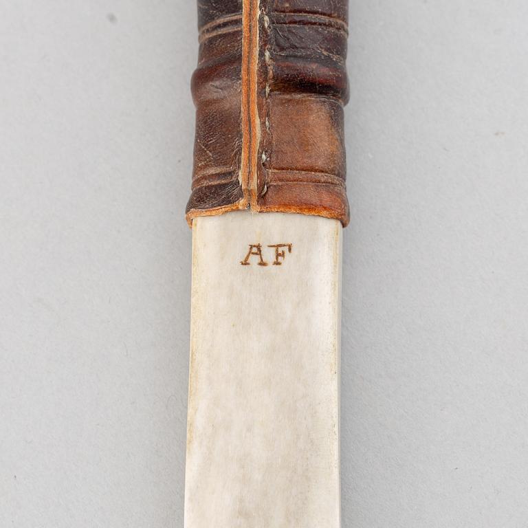 Anders Fankki, a Sami reindeer horn knife, signed AF.