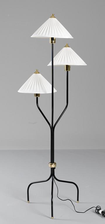 A Josef Frank brass and black laquered floor lamp, Svenskt Tenn, model 2599.