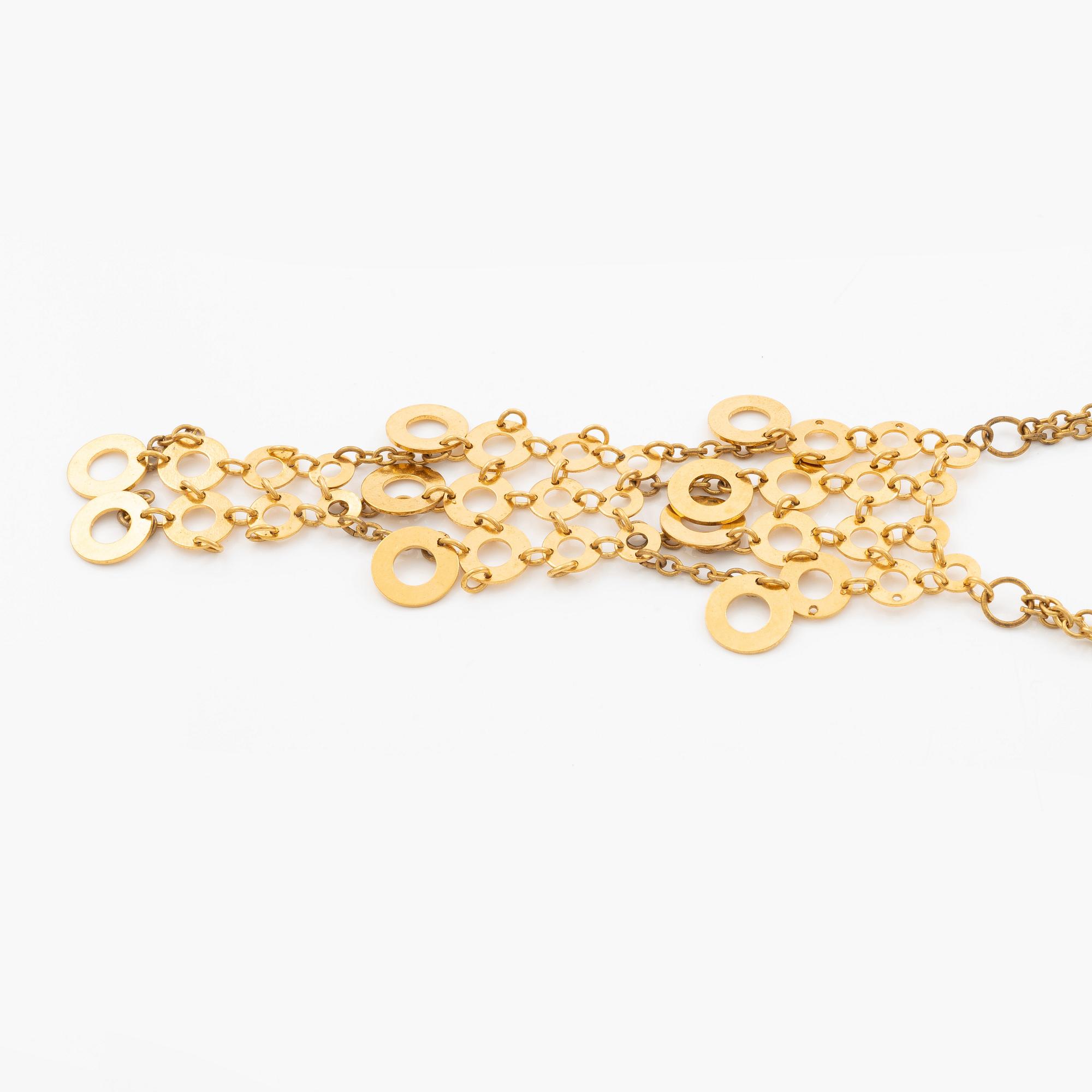 Siv Lagerström two necklaces in yellow metal.