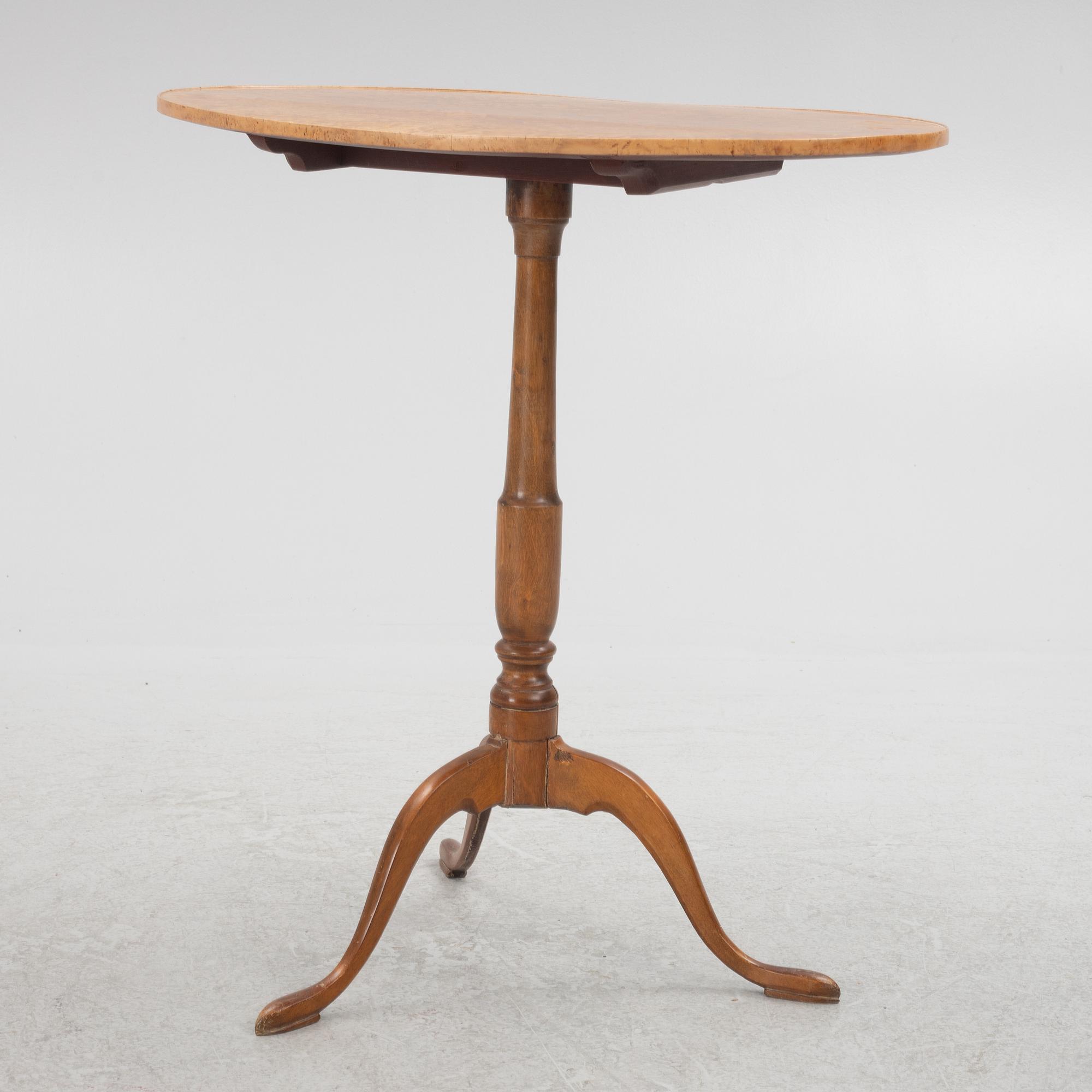 A 19th Century birch tilt top table.