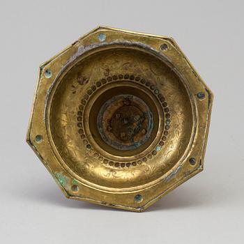 A 18th century Baroque brass candlestick.