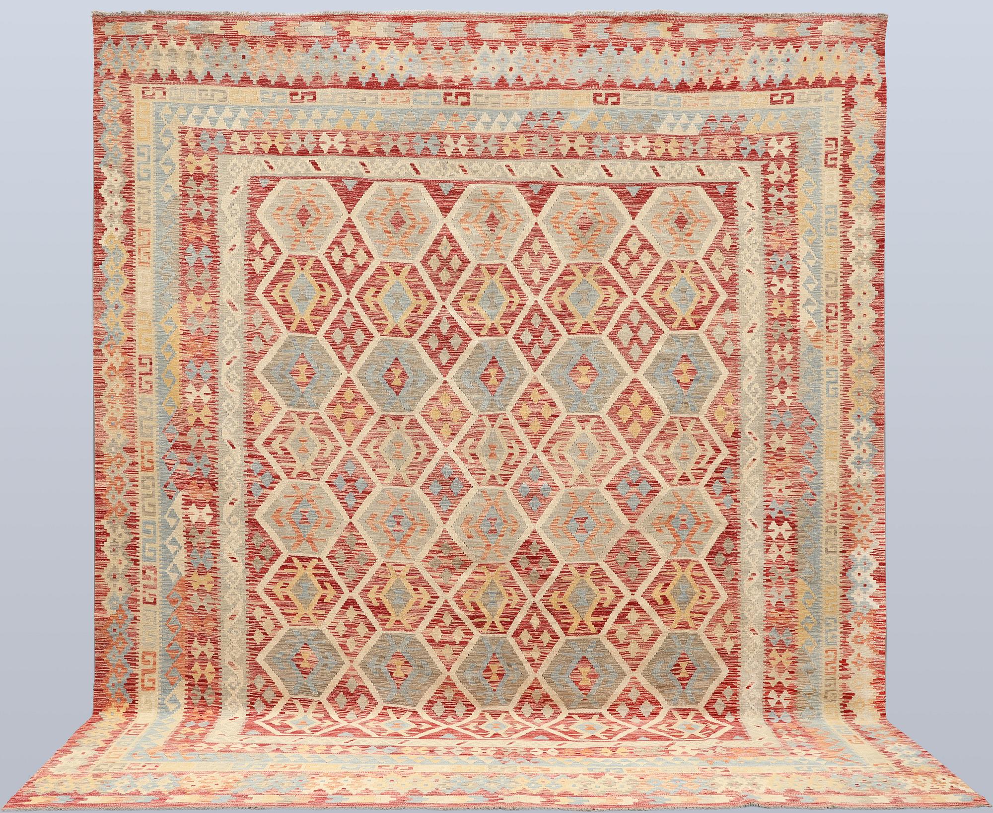 A Kilim carpet, approx. 379 x 313 cm.