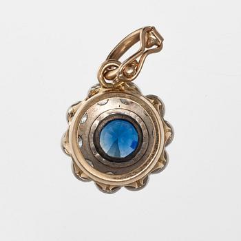 A PENDANT, 18K gold. Blue sapphire 8 mm diameter and brilliant cut diamonds c. 0.80 ct. Weight 8 g.