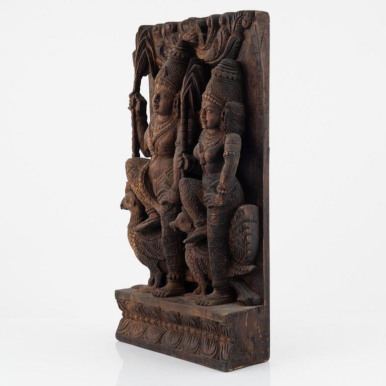 A carved wooden relief, presumably India, 20th century.