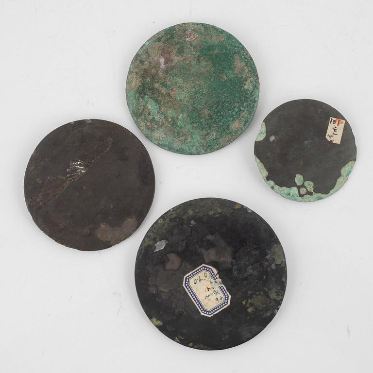 Four bronze lobed mirrors,  Han dynasty (206 B.C.-220 A.D.).