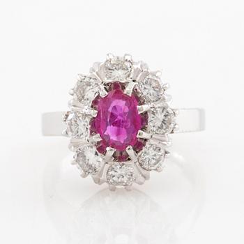 Ring Carmosé 18K white gold with an oval faceted ruby and round brilliant-cut diamonds, Reutners Ystad 1974.