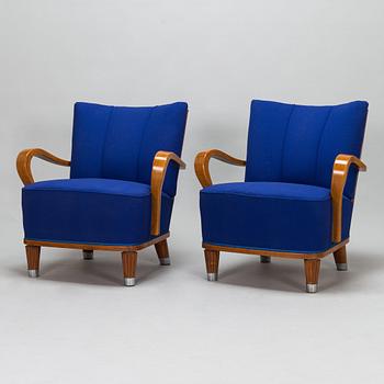 A pair of open armchairs and a coffee table were made to order in 1941.