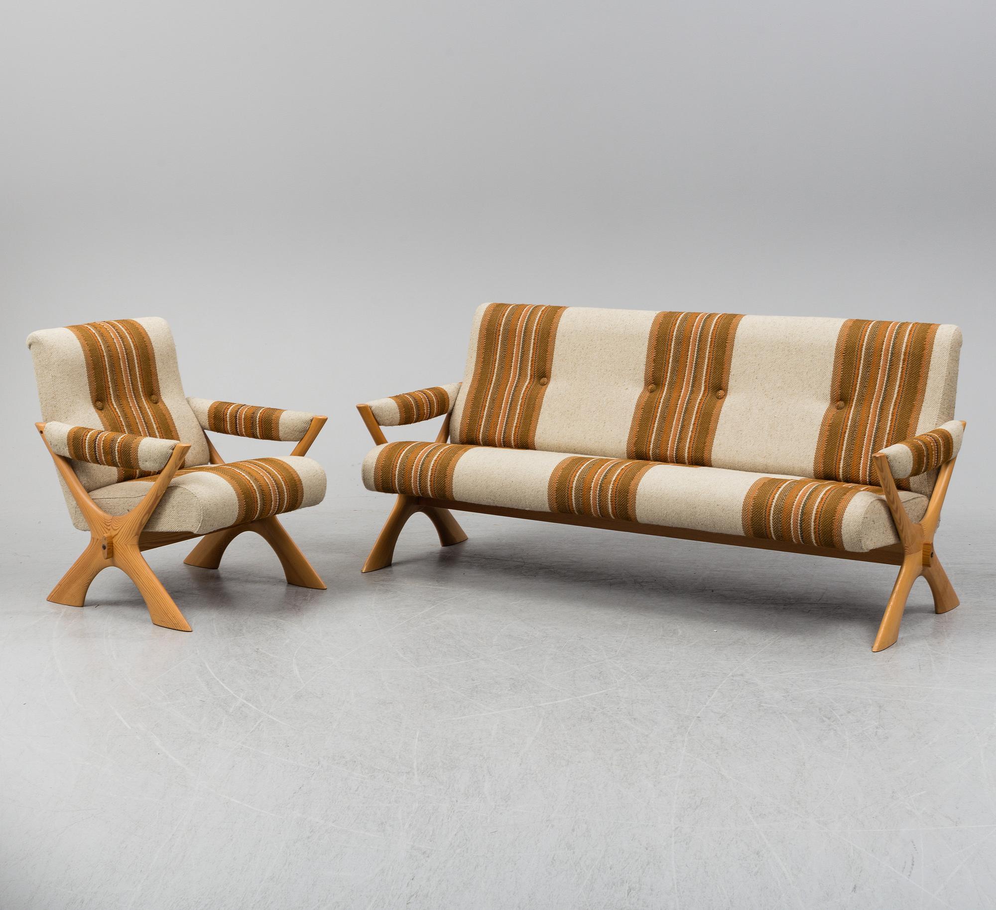 A 1960/70's pine sofa, armchair and coffee table.