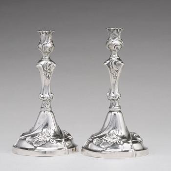 A pair of Swedish 18th century rococo silver candlesticks, mark of Jacob Lampa, Stockholm 1772.