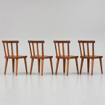 Axel Einar Hjorth, a set of four stained pine "Utö" chairs, Nordiska Kompaniet, Sweden 1930s.