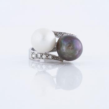 A cultured pearl and single cut diamond ring.