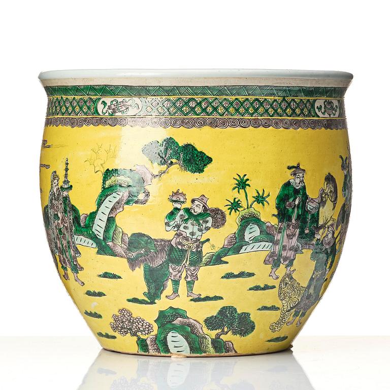 A large yellow ground famille verte bisquit jardiniere, Qing dynasty, 19th century. Marked 'Tack Loong Canton China'.