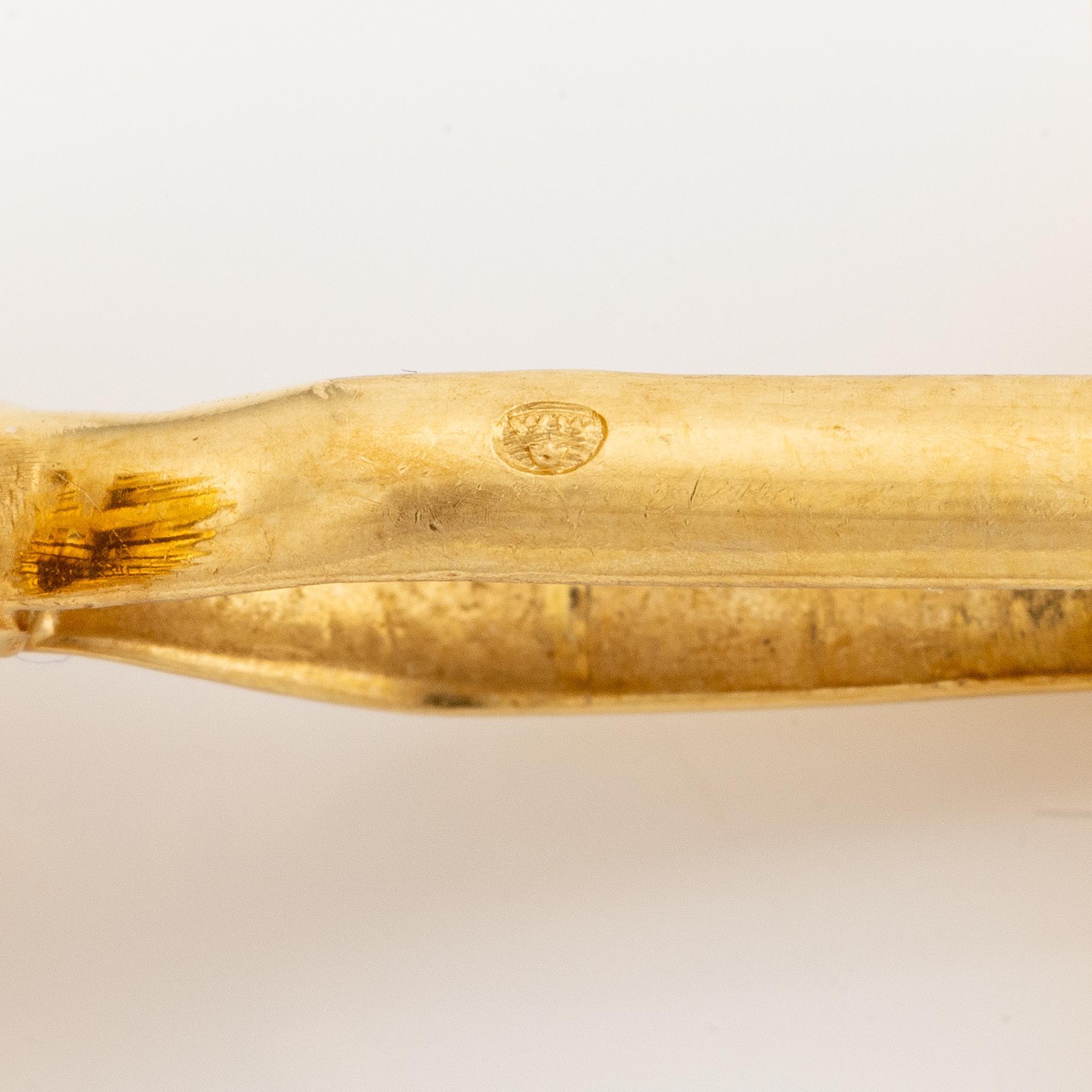 Ett par manschettknappar 18K guld med åttkantslipade diamanter samt rubiner.