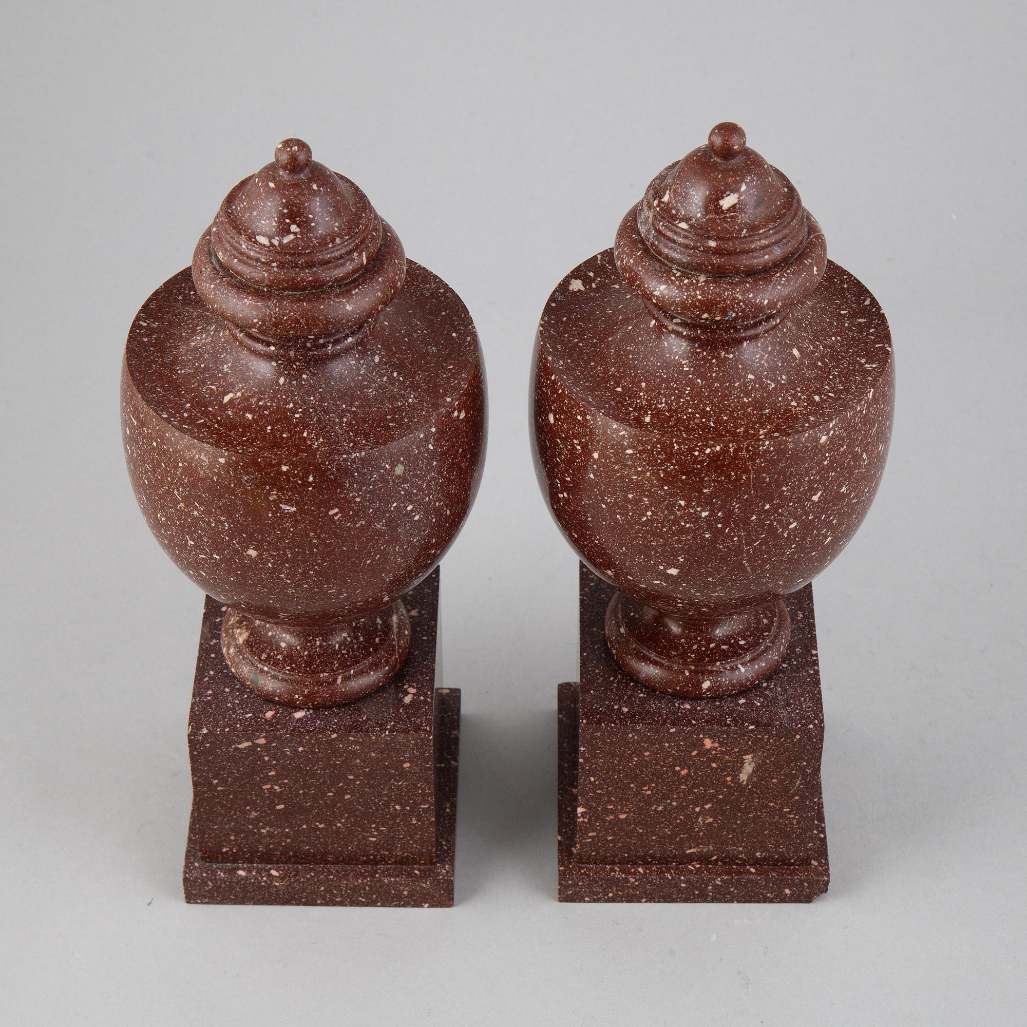 A pair of porphyry urns, presumably first half 20th century.