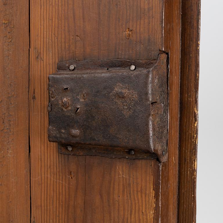 A stained pine Baroque cabinet, on a later stand. From around the year 1700.