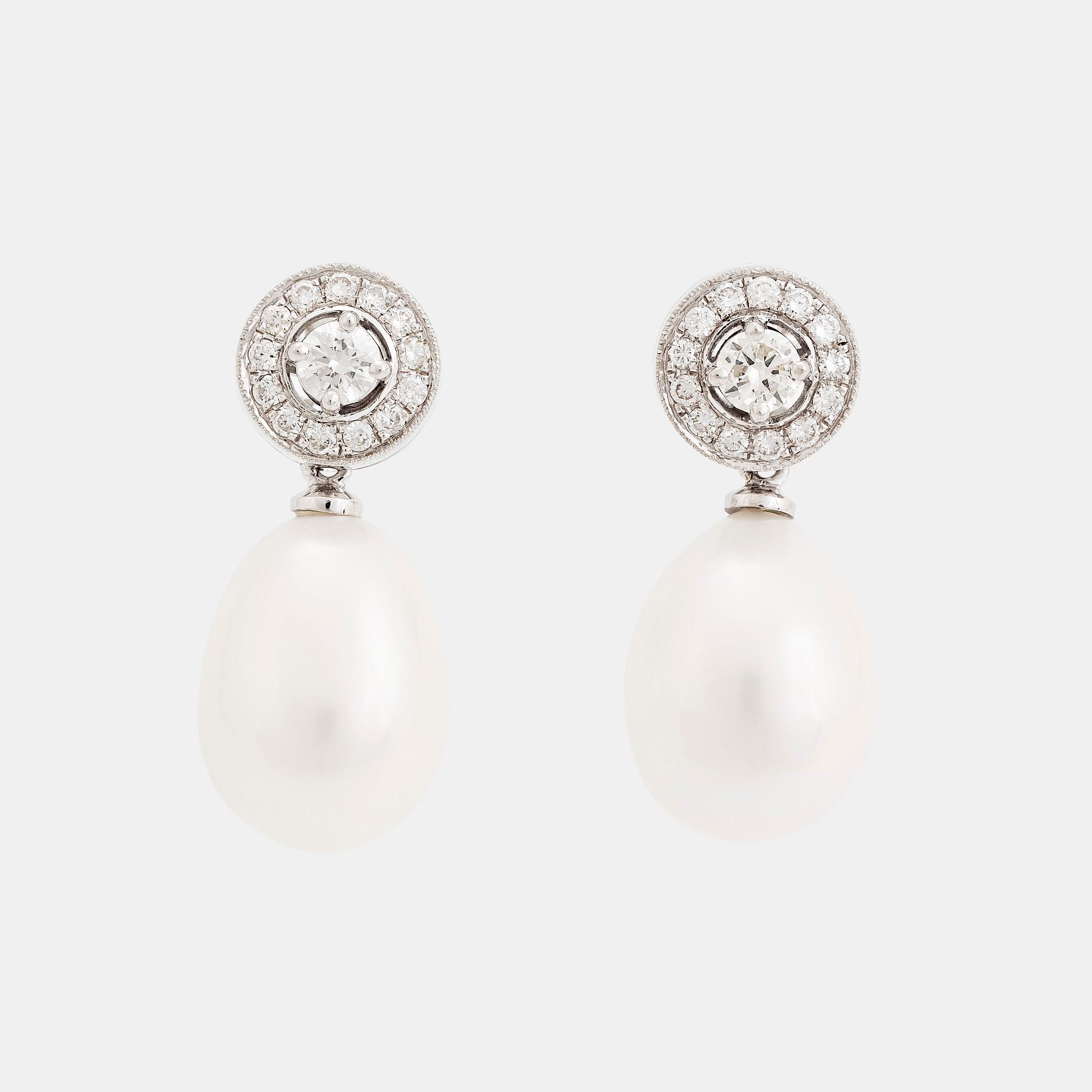 A pair of 18K white gold and cultured pearls earrings set with round brilliant-cut diamonds.