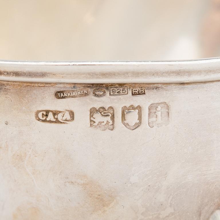 A pair of sauce jugs, maker's mark of Charles & George Asprey, London 1904, and 20th-century sauce jug. Sterling silver.