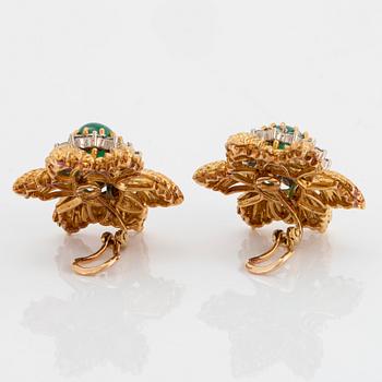 A pair of 18K gold earrings set with cabochon-cut emeralds and round brilliant-cut diamonds.