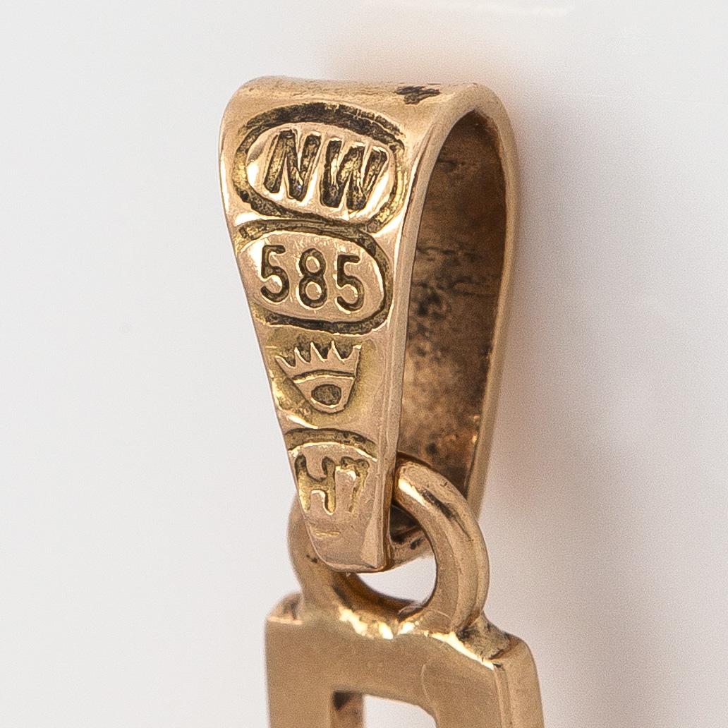 Pendant / cross, cabochon cut garnet, 14K gold, Westerback, Helsinki 1961.