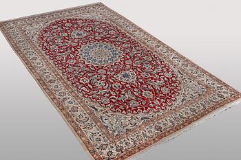 A carpet, Nain, part silk, 9 Laa, ca 295 x 178 cm.