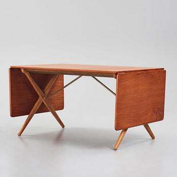 Hans J. Wegner, a teak and oak drop-leaf dining table, Andreas Tuck, Denmark 1950s-1960s.