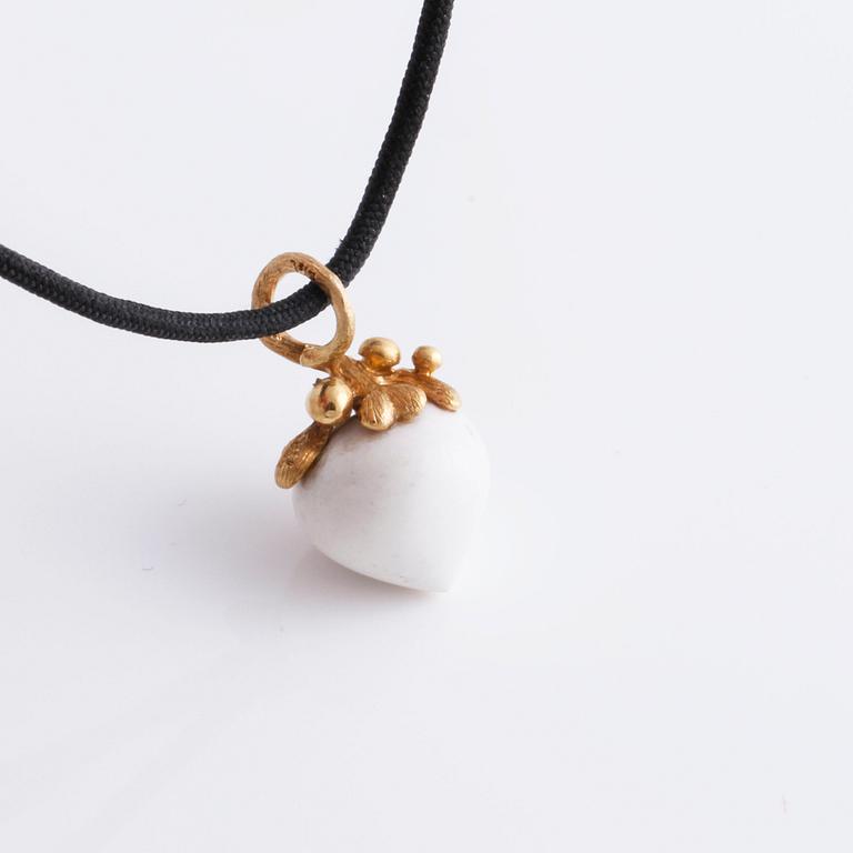 A bracelet, " My little world" by Charlotte Lynggaard.