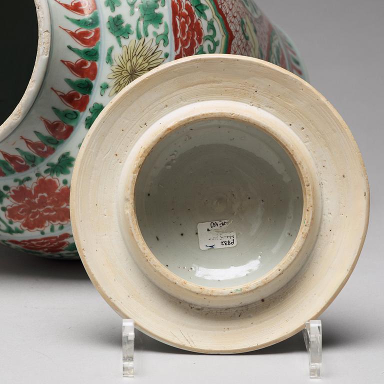 A Transitional wucai baluster vase with cover, 17th Century.