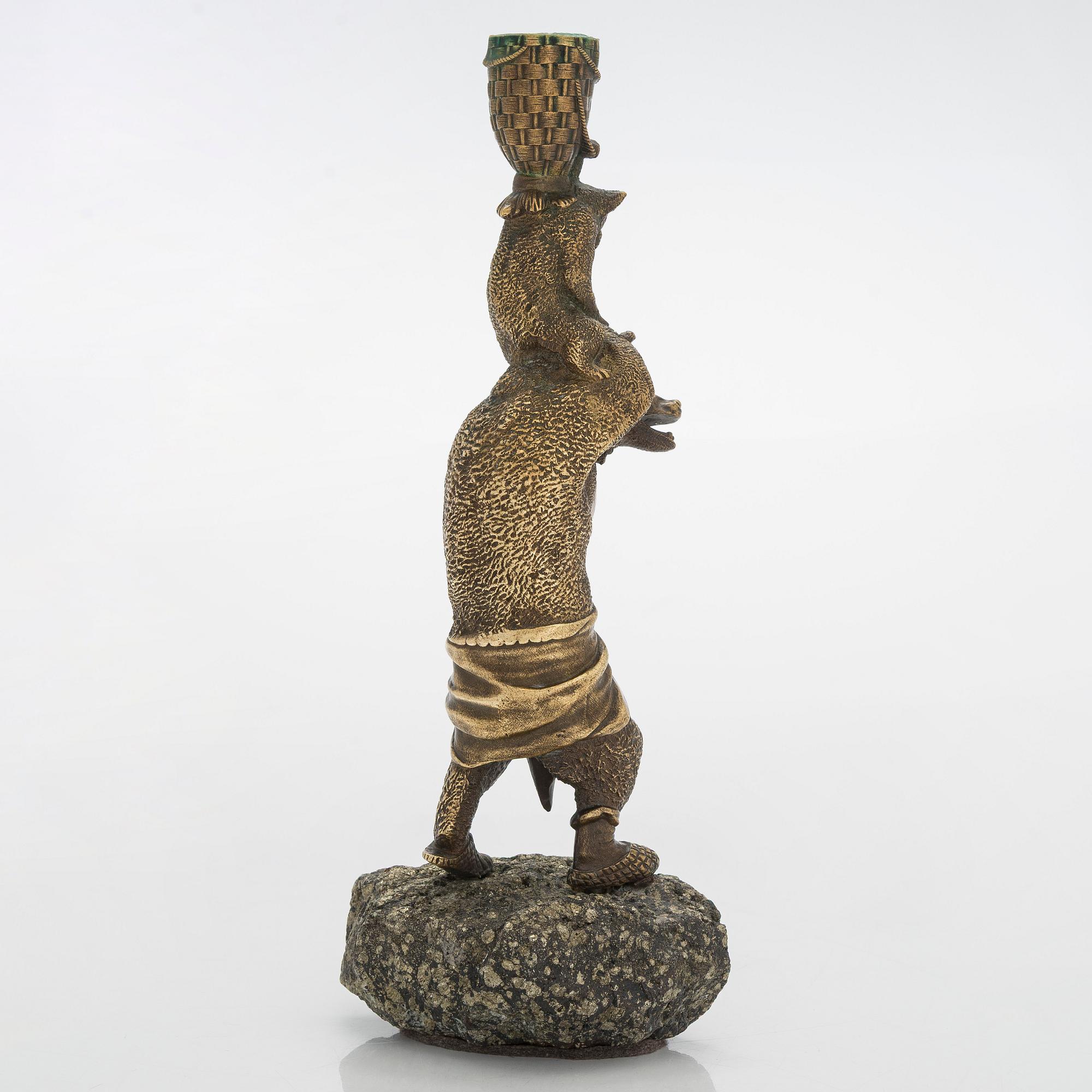 A Russian bronze candle holder, circa 1900.