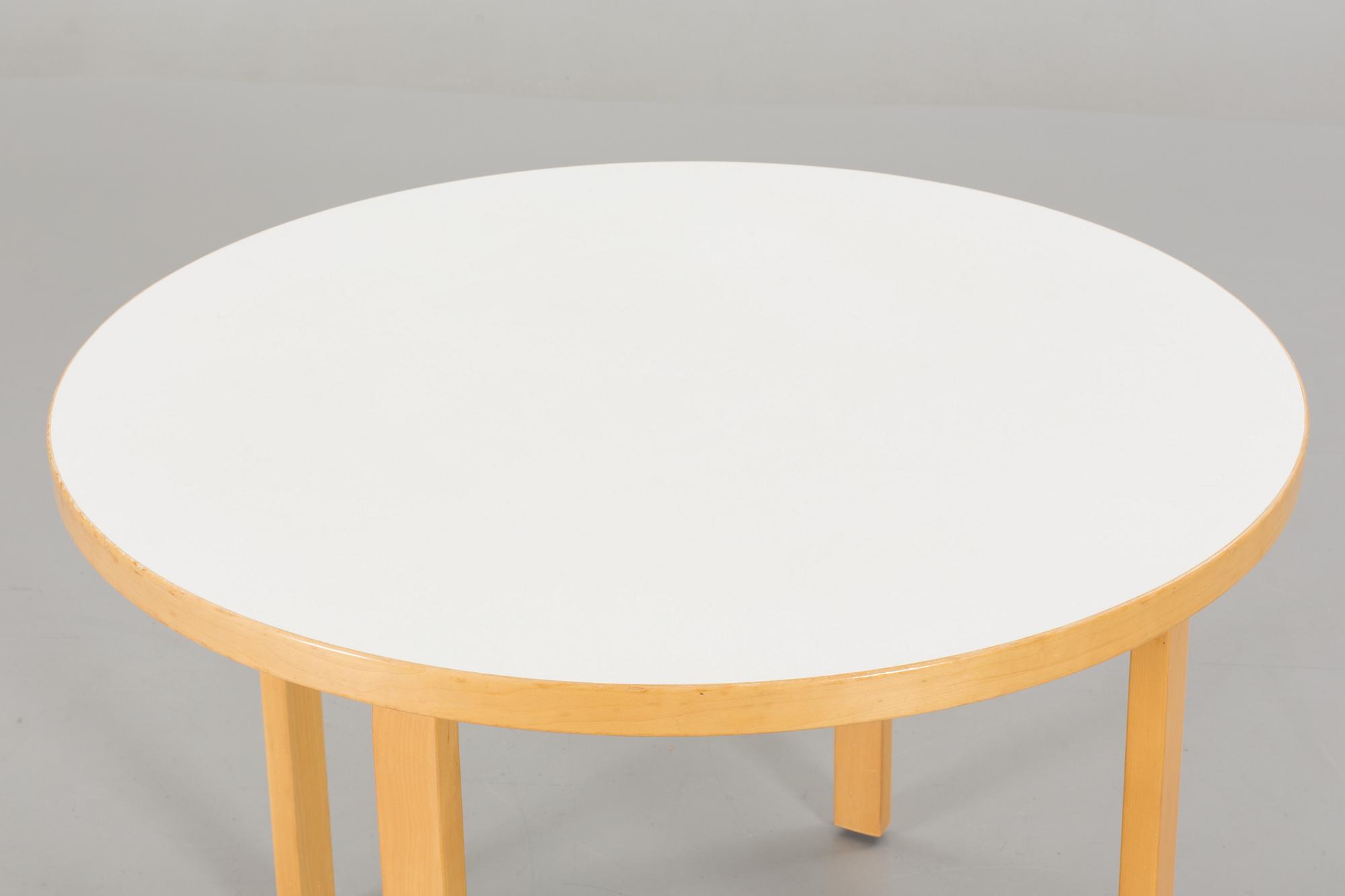 A TABLE AND FOUR CHAIRS DESIGNED BY ALVAR AALTO FOR ARTEK.
