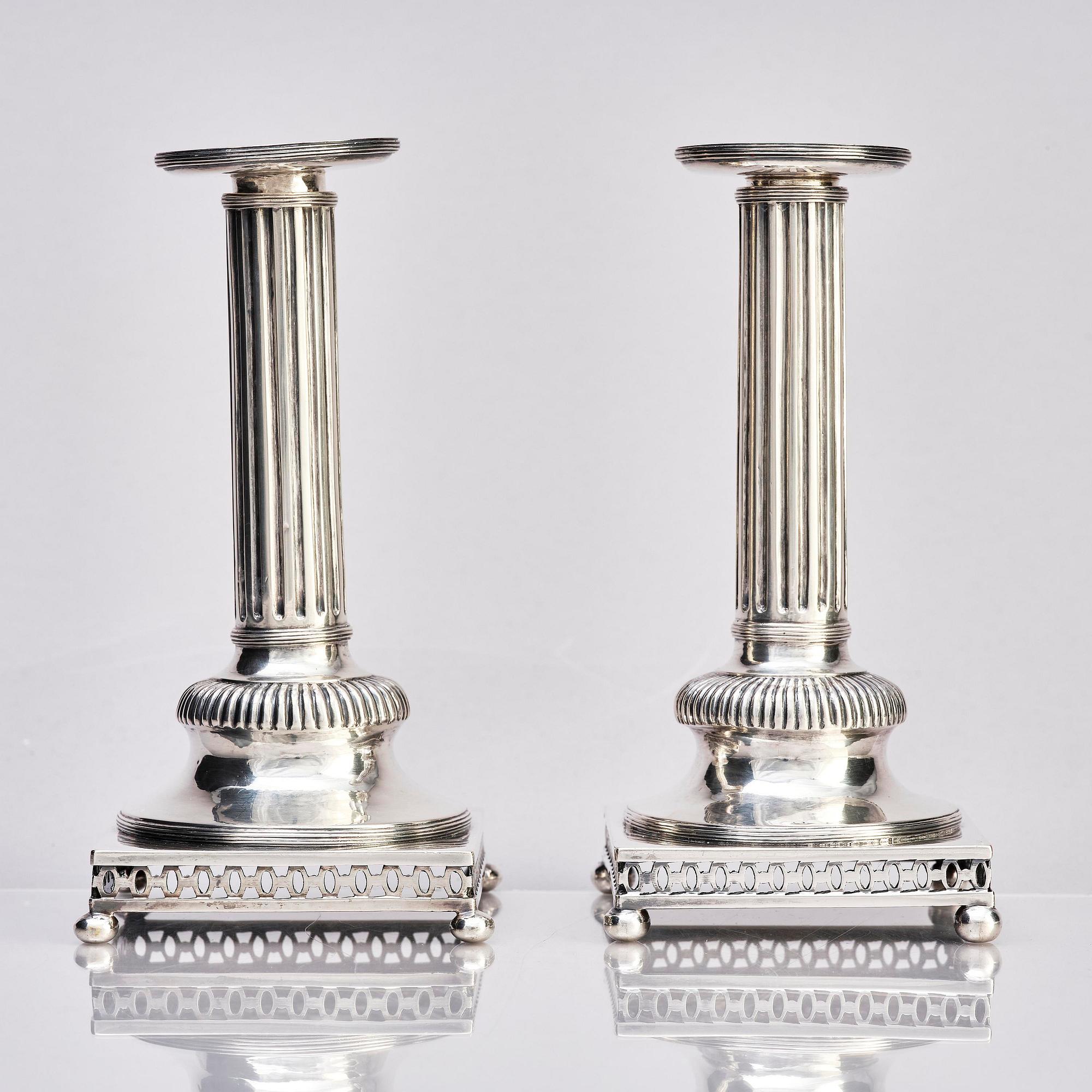 A pair of Swedish 18th century Gustavian silver candlesticks, marks of Arvid Floberg, Stockholm 1799.