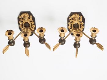 A pair of Empire three-light wall-lights, early 19th century Stockholm or St Petersburg.