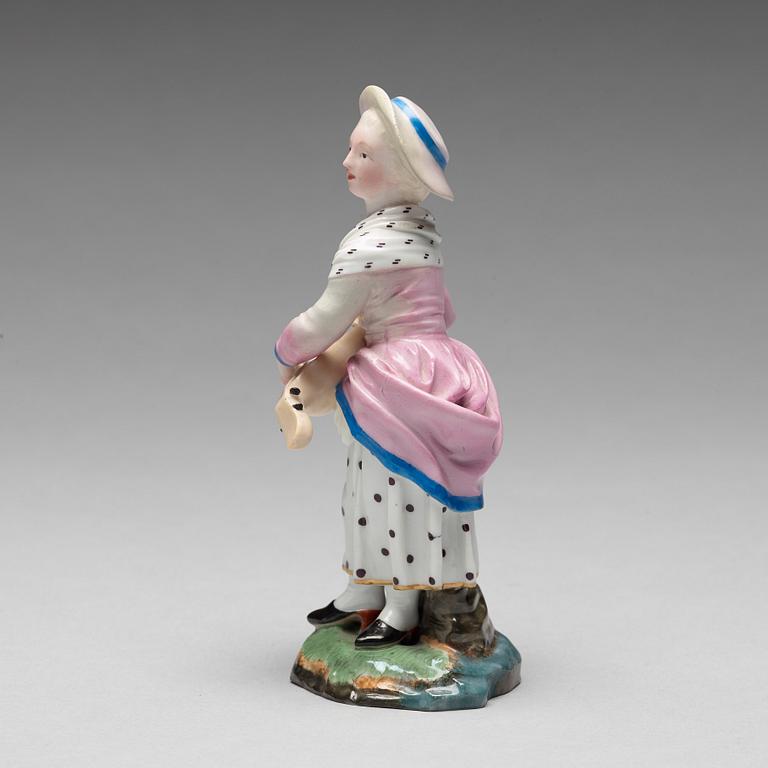 A porcelainfigure of a female musician, "Höchst mark", circa 1900.