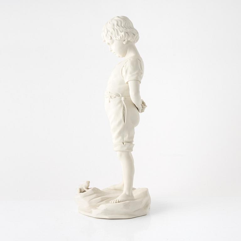A 'Gosse med groda' figurine, Gustafsberg, Sweden, dated 1904.