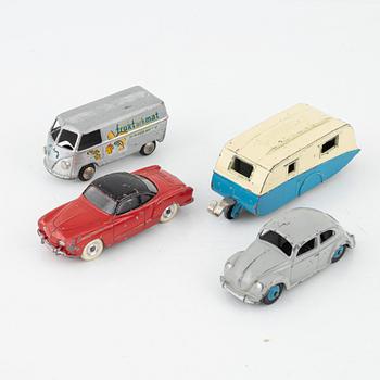 Nine toy cars, mostly Dinky toys.