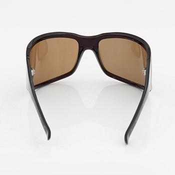 Bottega Veneta, a pair of sunglasses.