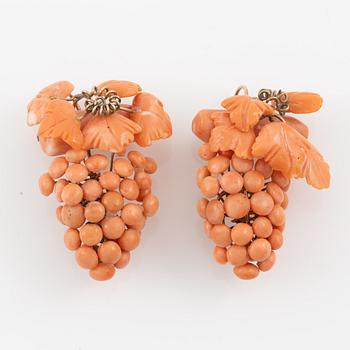 Earrings with coral in the shape of grape clusters.