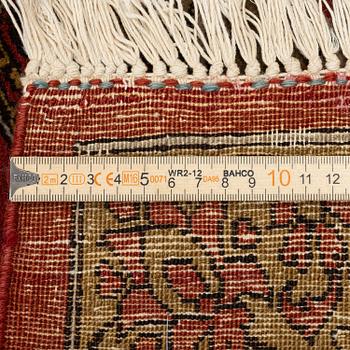 A Qum carpet, Central Persia, c. 310 x 190 cm.