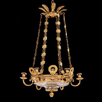 An Empire cut glass and gilded bronze six-light hanging lamp in the manner of Alexandre Guérin.