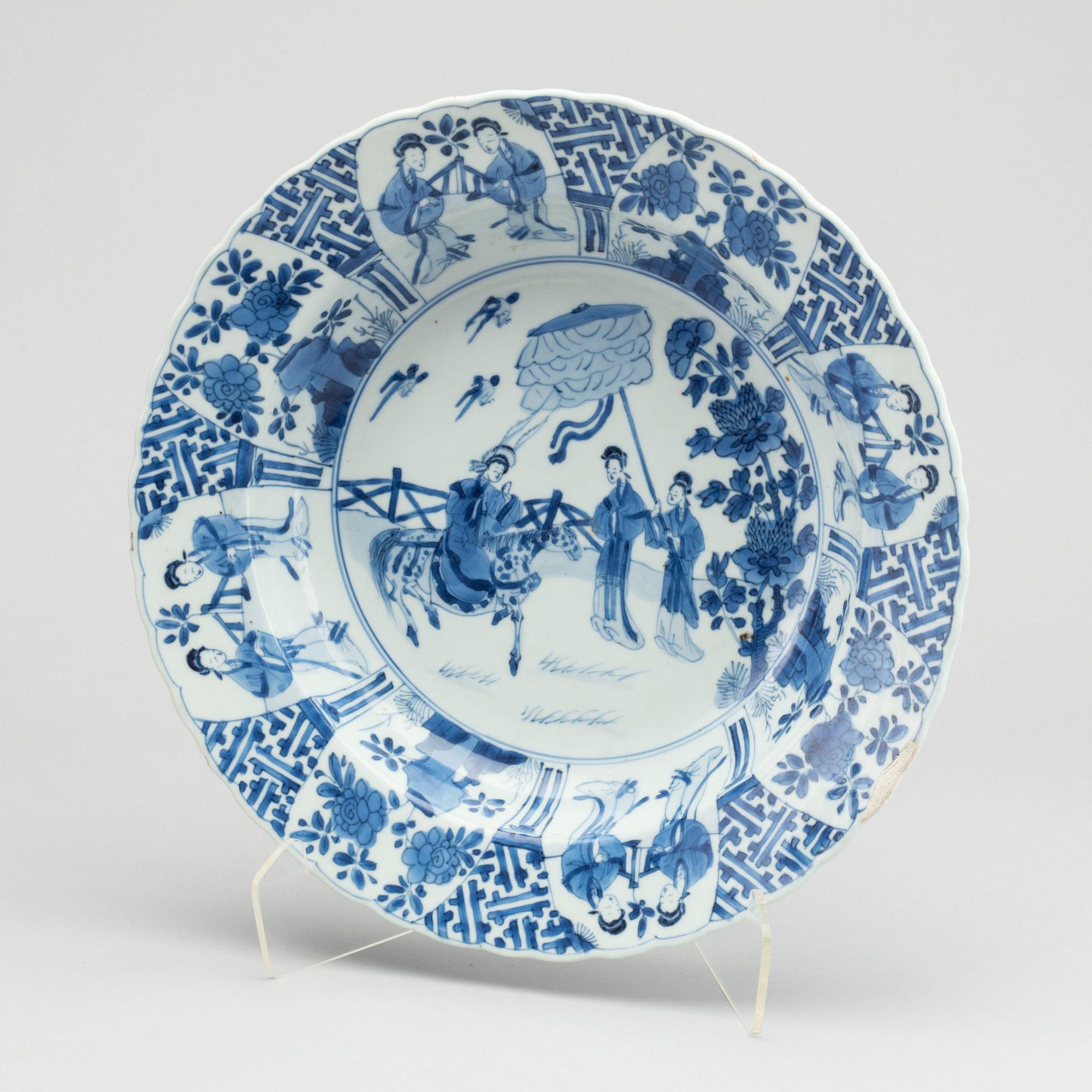 A large blue and white deep dish, Qing dynasty, with Kangxi six character mark and period (1662-1722).