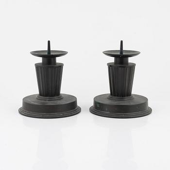 A pair of bronze candlesticks, 1920's-/30's.