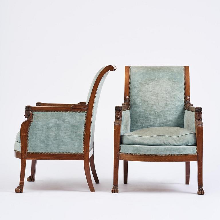 A pair of French Empire mahogny armchairs.