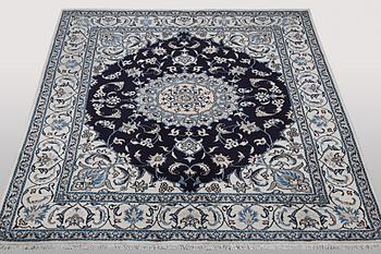 A carpet, Nain, part silk, ca 256 x 199 cm.