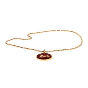 778. CELINE, a gold colored chain with pendant.