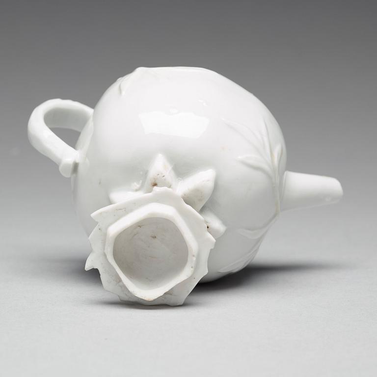 A pomegranate-shaped blanc de chine teapot with cover, Qing dynasty, Kangxi (1662-1722).